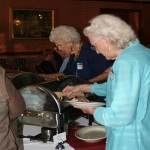 LWV members help themselves to the buffet at Sergio's