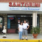 Zhanetta (left) and husband Petraq Strakosha in front of their Oviedo restaurant - Santorini's  (Photo - CMF Public Media)