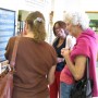 Valada Flewellyn talks to exhibit visitors (photo - CMF Public Media)